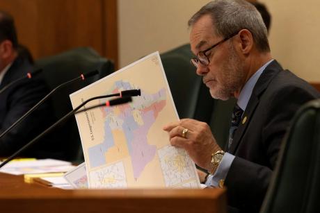State Sen. Kevin Sparks, R-Midland, looks over a proposed congressional map during a redistricting hearing at the Texas Capitol in Austin on Aug. 6, 2025.