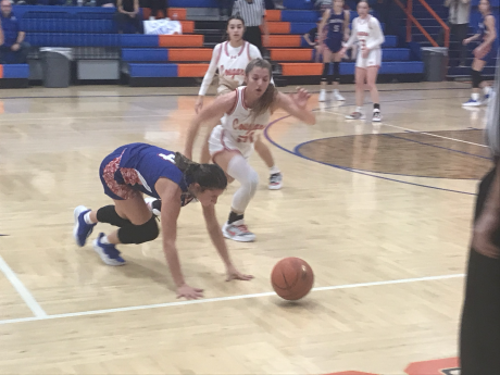 Christoval's Sophia Nemec and Coleman's Savannah Hurtado hustle toward a loose ball in their playoff game Monday, Feb. 16, 2026.