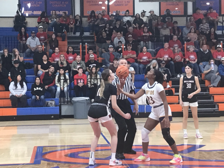 Ballinger's Ysee Le Borgne and Ozona's Aaliyah Renteria prepare for the opening tip of their playoff game Monday, Feb. 16, 2026.