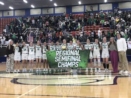 The Wall Lady Hawks celebrate after their 35-25 win over Idalou on Tuesday in the regional semifinals in Snyder.