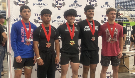 Ballinger’s Treyven Lopez (second from left) took third place in the 132-pound class Friday at the Division IV state powerlifting meet at the Taylor County Expo Center in Abilene.