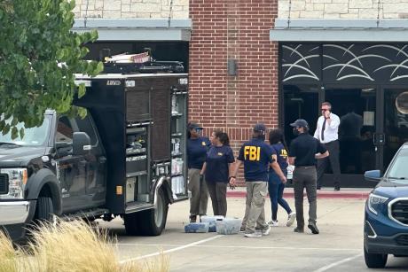 Law enforcement responds to the scene of a shooting on Tuesday, May 5, 2026, at K Towne Plaza in Carrollton.