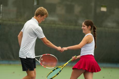 Garden City's Presley Jost and Lacy Seidenberger celebrate a point during the 2026 UIL Tennis State Championships. They went on to win the Class 1A mixed doubles state title.