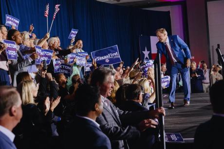 Texas Attorney General Ken Paxton shakes hands with cheering supporters at his election night watch party in Plano after winning the Republican candidacy for U.S. Senate on May 26, 2026.