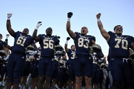 The Navy football team celebrates a win during the 2025 season.