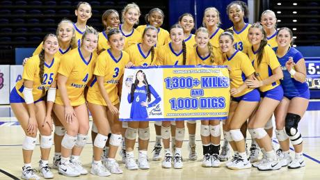 2026 Volleyball Team celebrating Madi Parrish 1,000 digs