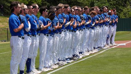The Angelo State baseball team stands before a game during the 2025 season.