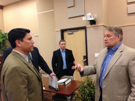 City Manager Daniel Valenzeula and Charles Young discuss the trash controversy after the press conference. (LIVE! Photo/Joe Hyde)