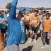 Former San Angelo Central head football coach Brent Davis talks to players during a workout.