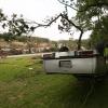 An overturned vehicle on the banks of the Blanco River on May 26, 2015, two days after catastrophic flooding in the Wimberley area.
