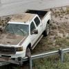 On the east side of the Bell Street overpass were more flooded cars revealed after the flood waters receded. 