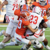 Mason Van Sickle (7) and Luisangel Garcia (33) combine for a tackle against Odessa High in their 2024 game at San Angelo Stadium.