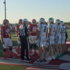 Captains for the Wall Hawks and Jim Ned Indians meet at midfield for the coin toss before their football game Friday, Sept. 12, 2025.