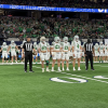 Wall's captains walk to midfield for the coin toss before their Class 3A Division II state final against Newton on Thursday, Dec. 18, 2025.