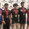 Ballinger’s Treyven Lopez (second from left) took third place in the 132-pound class Friday at the Division IV state powerlifting meet at the Taylor County Expo Center in Abilene.