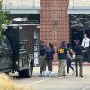 Law enforcement responds to the scene of a shooting on Tuesday, May 5, 2026, at K Towne Plaza in Carrollton.