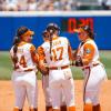 The Texas Longhorns softball team meets in the infield during the 2026 Women's College World Series.