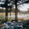 A cross honoring the victims of the July 4, 2025, flood stands in front of Camp Mystic across the Guadalupe River on Nov. 21, 2025.
