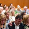 Edward Eastland breaks down in tears as he’s comforted by Tweedy Eastland, right, and Mary Liz Eastland, left, during a hearing on a lawsuit against Camp Mystic in an Austin courtroom on April 14, 2026.