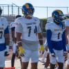 Angelo State players (from left) Viliami Salakielu, Isaiah Mworia, Demetrias Charles and Zach Burton prepare for the Rams' game against Western Colorado on Thursday, Sept. 3, 2026.