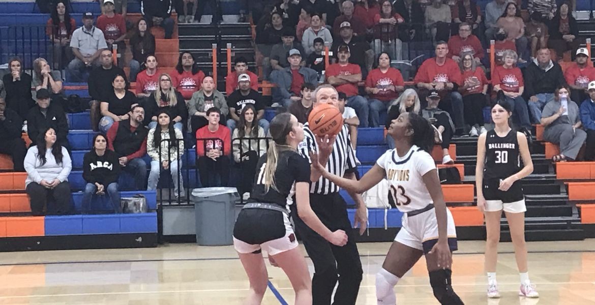 Ballinger's Ysee Le Borgne and Ozona's Aaliyah Renteria prepare for the opening tip of their playoff game Monday, Feb. 16, 2026.